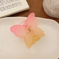 Pink and orange gradient butterfly hair claw clip with a matte finish on a ceramic plate - Pink Yellow Gradient