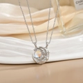 Macro shot of silver crescent moon and star necklace with shimmering aurora gemstone - Silver Moonstone Moon Star Necklace XL0284G