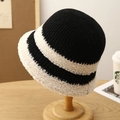Knitted black and white striped bucket hat for women on a stylish wooden display stand - M (56-58cm) / Black