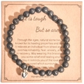 Black lava stone bead bracelet with heart charm on a kraft gift display card - Black Lava Stone With Card Style
