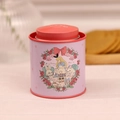 Pink tin canister with Alice in Wonderland tea theme and bunny illustration - Alice