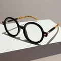 Lunettes de soleil rondes noires rétro avec branches en écaille et détails latéraux - Monture Noire Verres Unis Branche Léopard