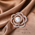 Rose gold flower brooch with white pearl and rhinestones on brown silk background - Y-13 Hollow Camellia Brooch