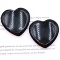 Polished black heart-shaped natural crystal massage stones with smooth groove surface - Obsidian