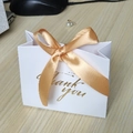 White paper gift bag with gold ribbon bow and Thank You text for wedding favors - White Bag Gold Ribbon / 11.5*4.5*10