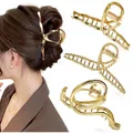 Three-piece gold metal large claw clips in minimalist, twisted, and streamlined designs - Gold 3-Piece Set