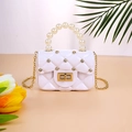 White quilted mini jelly handbag with pearl handle and rhinestone accents - White