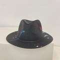 Detail of artistic red, blue and white graffiti paint on a black straw panama hat - M / Black (Graffiti Splatter)