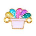 Détail d'une breloque fleur en émail coloré avec paillettes pour création de bijoux - Plante en Pot Colorée