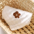 Soft cotton gauze baby bib in cream white with a delicate brown flower embroidery detail - Small / Flower