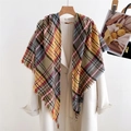 Detailed shot of British plaid scarf with tassels styled over a white coat - 200x90x130cm / Yellow
