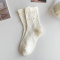 Detail of beige JK style calf socks featuring knitted floral relief and ribbed cuffs - Double Rings
