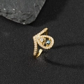 Macro detail of gold-plated open ring with blue evil eye enamel and zircon stones - M-Gold Rhinestone Blue Eye
