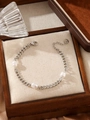 Detail of stainless steel pearl bracelet with lobster clasp and baroque pearls in a gift box - Silver Stainless Steel 3-Pearl Flat Chain Bracelet