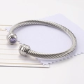 Silver cable wire bangle with purple zircon stone in a vintage open cuff design - June/Light Purple