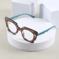 Cat-eye brilmontuur met donkere ambertextuur en matte groenblauwe pootjes modern design - Bruin Frame