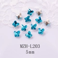Close-up of 5mm blue crystal butterfly nail charms with faceted finish on lace background - Blue Butterfly Style (L203) / 5mm