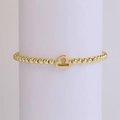 Golden Libra zodiac bead stretch bracelet featuring a minimalist 18k plated pendant - Libra