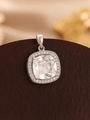 Macro shot of silver square pendant with large clear gemstone on brown leather surface - Silver White Zircon