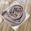 Détail d'une écharpe en mousseline rose grisâtre avec dorure, en forme de fleur - Vieux rose
