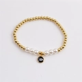 Boho-Armband aus goldenen Perlen mit weißen Perlen und schwarzem Evil-Eye-Anhänger - Schwarz