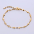 Close-up of golden star-shaped link bracelet with lobster clasp and extension chain - Pentagram