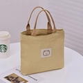 Yellow canvas tote bag with a cute cartoon bear embroidery and brown strap handles - Khaki