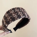Macro shot of French tweed headband texture in brown and black with non-slip lining - Coffee Black White Mix