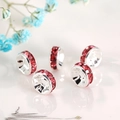 Macro shot of silver spacers with pink rhinestones for DIY jewelry making - Silver Plated Rose Red