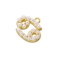 Macro shot of gold-plated metal and pearl pendant in a curly digit shape with hook - Gold Cancer Pearl Pendant