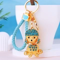 Exquisite gold metal poodle keychain with blue rhinestones and braided leather strap detail - Sky Blue Rope + Poodle Sky Blue