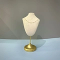 Golden necklace with white pearls displayed on a beige mannequin stand with gold base - High Necklace Bust Stand