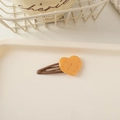 Detailed view of heart-shaped biscuit hair clip with a smooth brown metal snap pin - BB Clip Biscuit-Heart