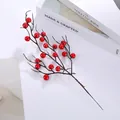 Top view of vibrant red artificial holly berry branches for home holiday decor - Red 21 Berries