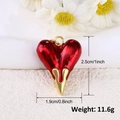 Macro shot of 18k gold heart charm with red enamel detailing dimensions and weight - A0279-Red Heart with Gold Drip Bottom (2.5x1.9cm)