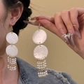 Detail of round shell-like plates with hanging white pearl tassels on gold-tone earrings - 11# Earring Hook - White (Double Disc Pearl Tassel)