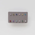 Macro shot of twelve colorful round cubic zirconia earrings in four-prong silver settings - 12-Color Single Set