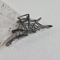 Detailed view of Halloween spider web metal hair claw in dark grey gunmetal finish - Alloy Metal / Gun Black Spider Web (10.5cm)