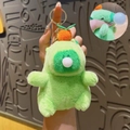 Green plush capybara dinosaur keychain with silver ring and shake-to-sound feature - Squeak Green Capybara