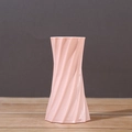 Pink ceramic vase featuring a unique twisted geometric design for modern home decor - Pink