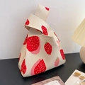 Knitted tote bag featuring red and pink strawberry patterns on a beige knit background - Red Strawberry - Beige