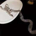 Silver bow hair claw with elegant multi-layer rhinestone tassels on white plate - 195# Silver Metal Bow Rhinestone Tassel Claw