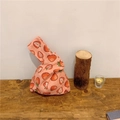 Close-up of Japanese cotton linen knot bag with pink strawberry print on wooden table - Small Strawberry