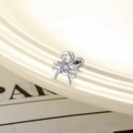 Silver bow heart earring with purple zircon and screw back on a beige textured base - Blue-Purple Heart Bow-knot Style (Single Piece)