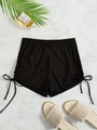 Detail of sheer black mesh beach shorts with side drawstring ties and ruched texture - XS / Bottoms / Black