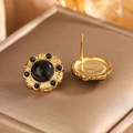 Close-up of vintage 18K gold plated earrings with radiating texture and black marble stones - Gold + Black Turquoise (Carved)