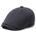 Dark grey wool blend flat cap for elderly men featuring warm ear flaps and metal logo detail - Adjustable / Gray