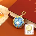 Vintage style Capricorn pendant in gold metal with blue crystals and a central pearl - Capricorn Style