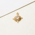 Macro detail of gold sunburst pendant with sparkling round zircon for jewelry making - Dainty Sunburst
