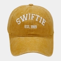 Mustard yellow washed cotton baseball cap featuring white SWIFTIE embroidery design - Yellow